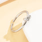 Stainless Steel Ring With A Braided Cord And Adjustable Opening